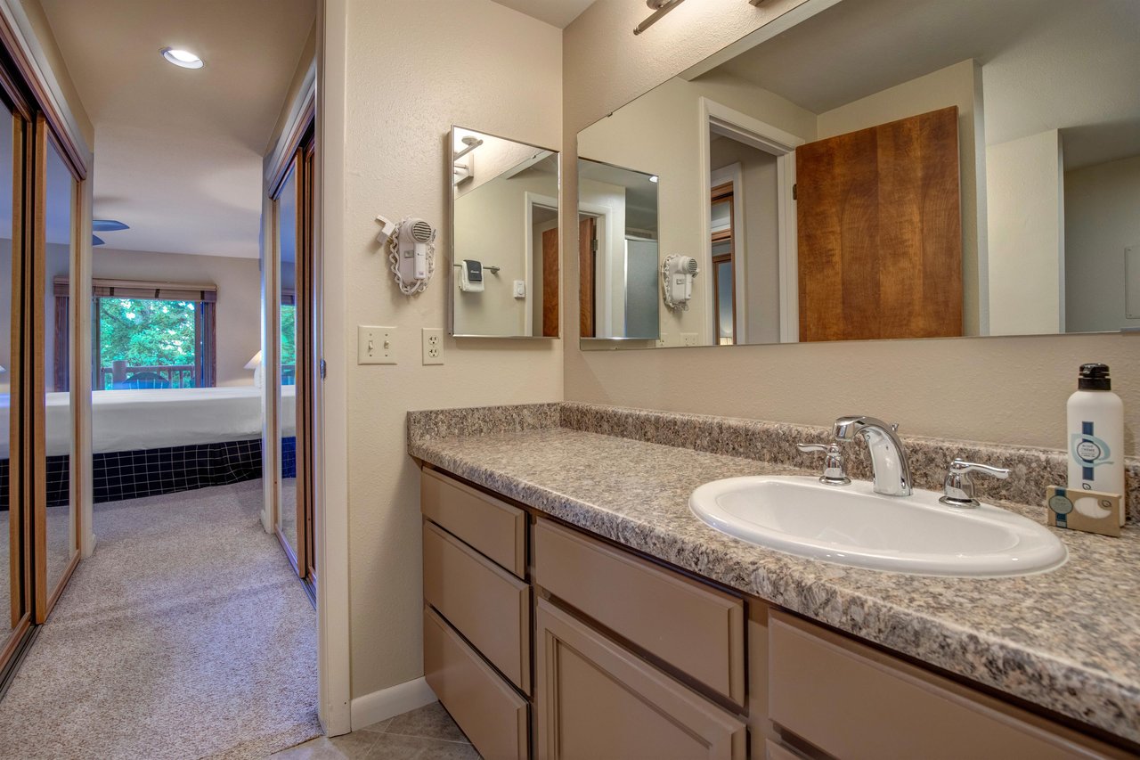The en suite bathroom with another sink area.