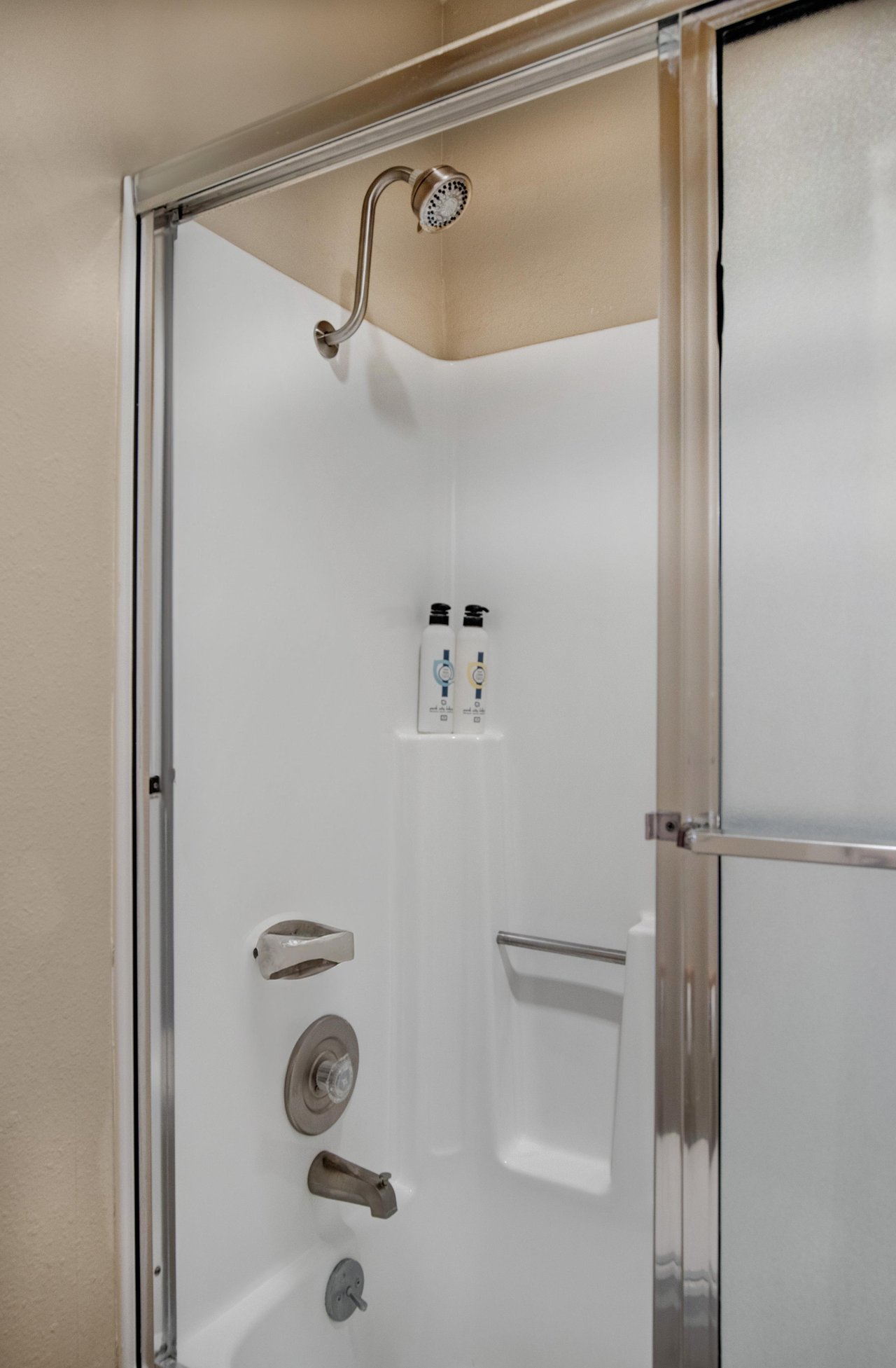 The loft bathroom has a bathtub and shower combination