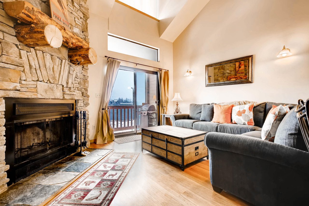 Cozy wood burning fireplace  ParkCityLodging_PowderPointe303B_LivingRoom 2