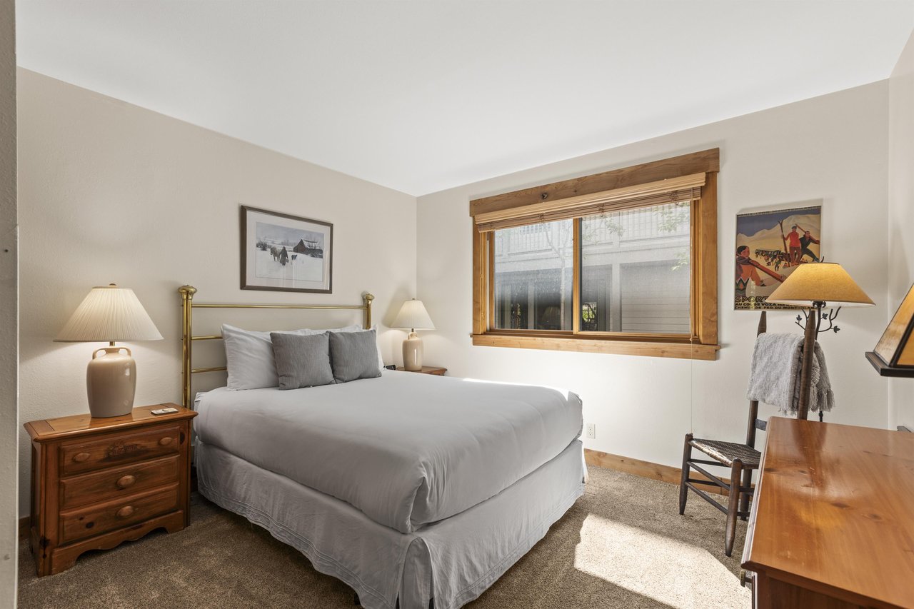 The bedroom offers a queen size bed.