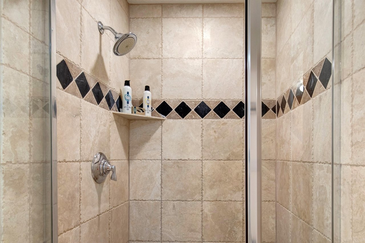 The en suite bathroom offers a walkin shower.