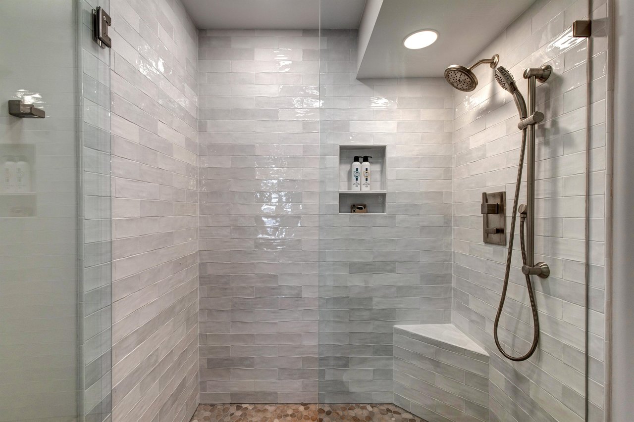 The en suite bathroom has a walkin shower with European glass door.