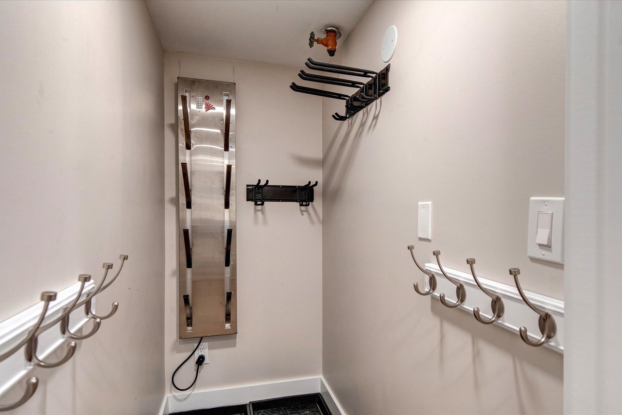 The storage room with plenty of hooks for gear, clothes and boots.