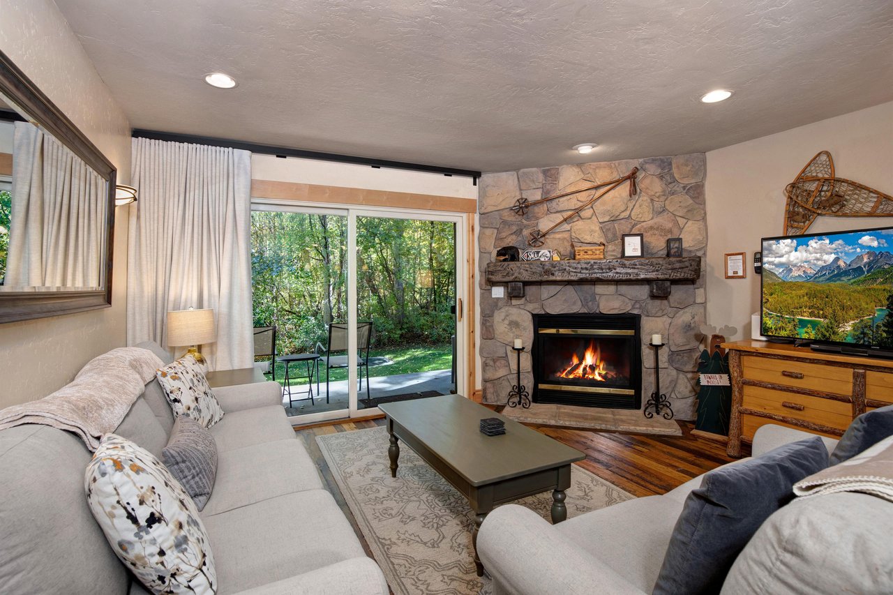 Snow Flower 132 has a cozy living room with a gas burning fireplace.