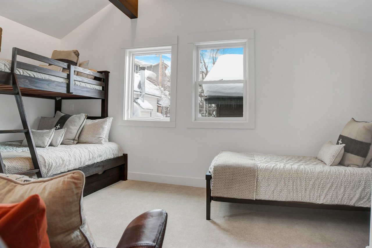 The third bedroom with a twin over full bunk bed with a twin trundle and a twin bed.