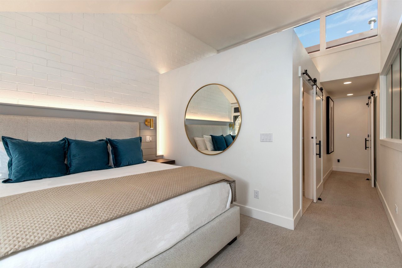 The spacious main suite with a kingsize bed.
