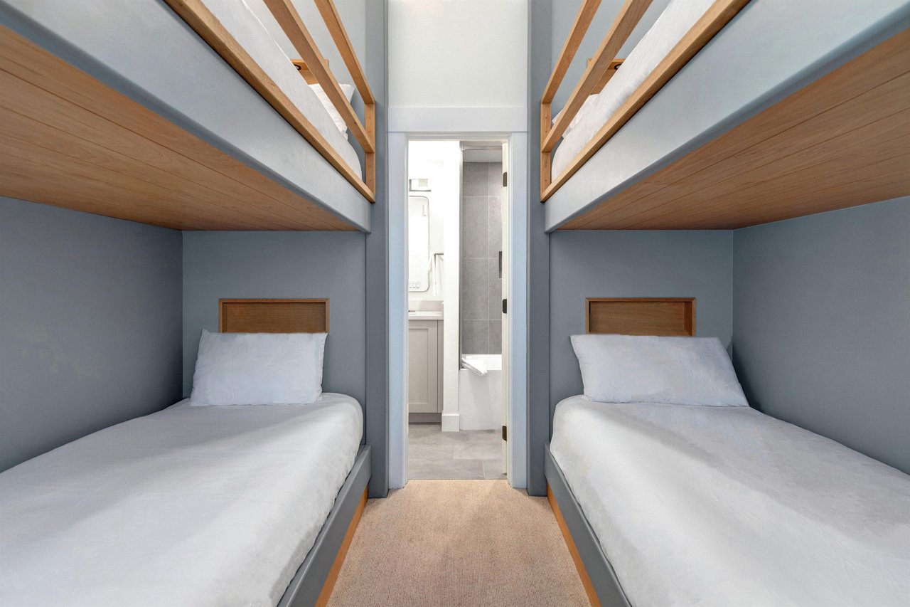 The third bedroom with two twin bunk beds and en suite bathroom.