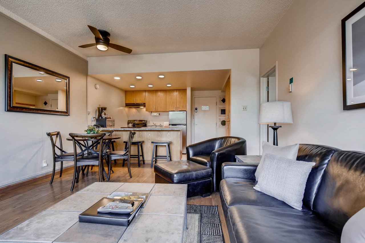 Comfortable open concept kitchen, dining, and living room.