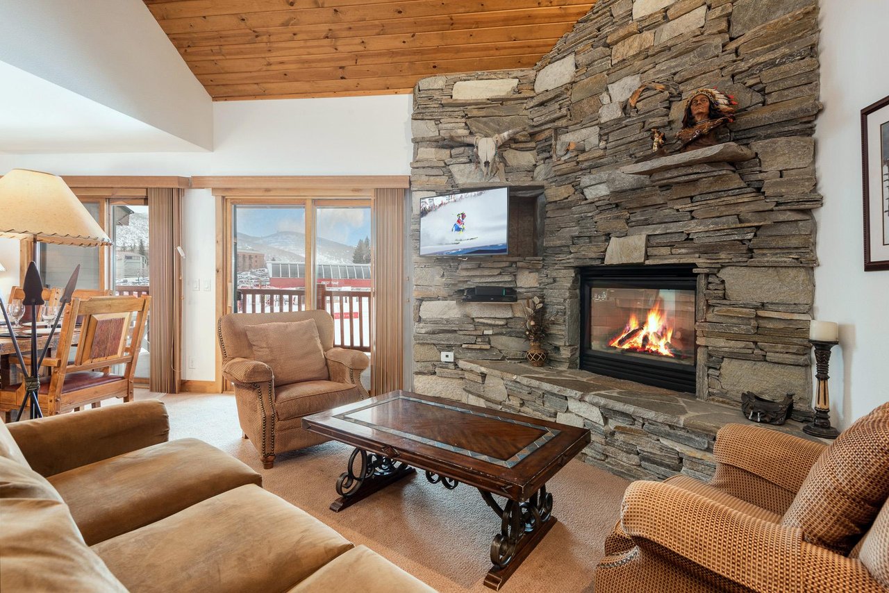 Snow Flower 74 offers a cozy living room with gas burning fire and overlooks Park City Mountain.