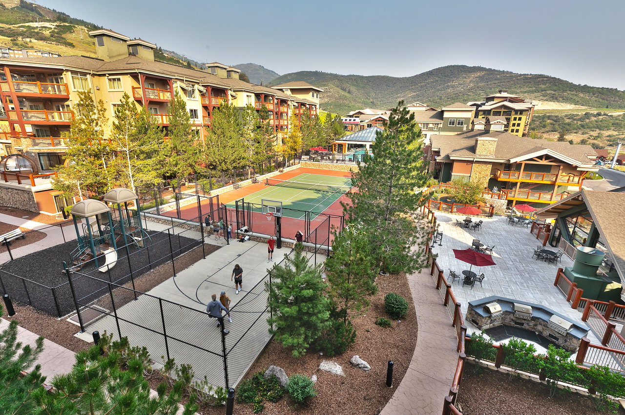 Aerial view of tennis courts, playground, and basketball court