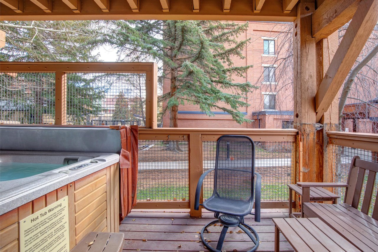 Relax in your private hot tub on the covered deck.