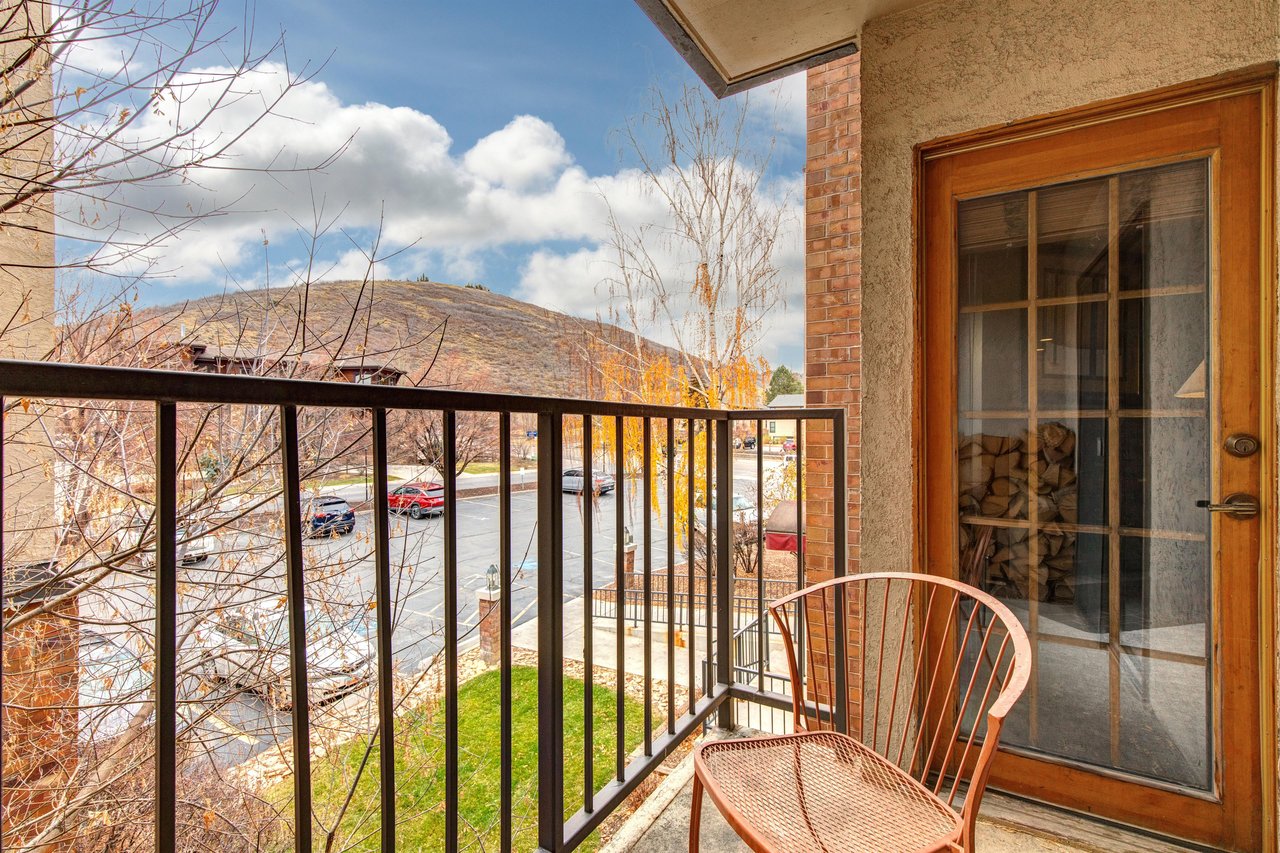 Step onto your private balcony and breathe in the crisp mountain air as you enjoy panoramic views of rolling hills and autumn colors from your cozy chair.