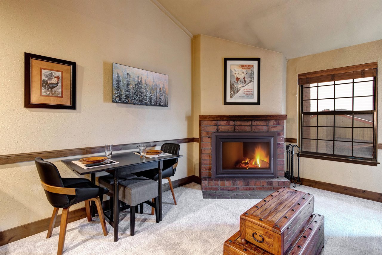 Cozy up by your crackling fireplace while enjoying intimate meals at your stylish dining table.