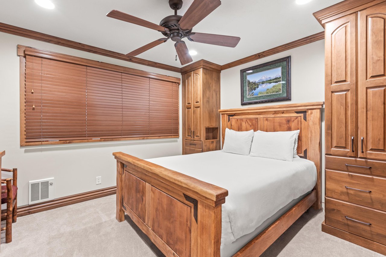 Rest peacefully in your handcrafted wooden bedroom, where rich cabinetry and crisp linens.
