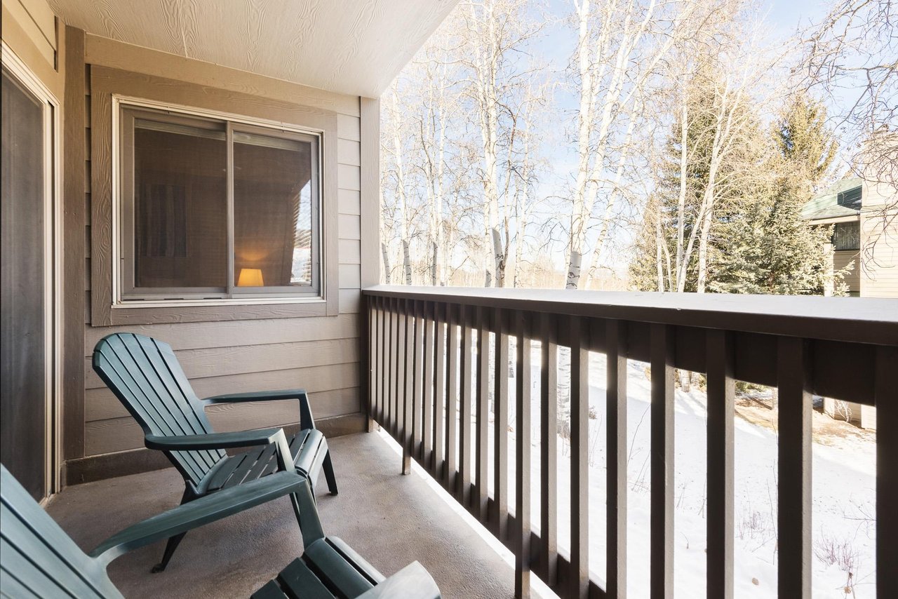 Premier Snow Flower Condominium 107s outside patio with nature views.