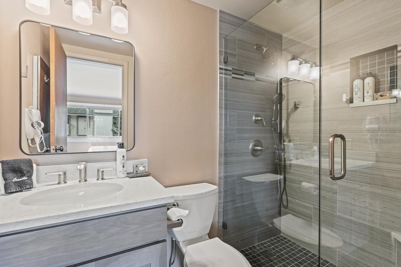 Premier Snow Flower Condominium 107s en suite bathroom with a walkin shower.