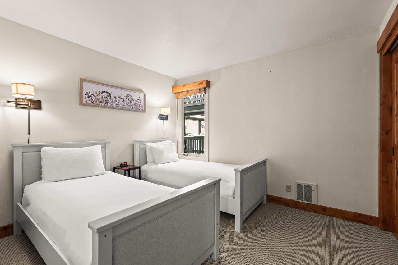 Snow Flower Condominium 149 offers a second bedroom with two twin beds.
