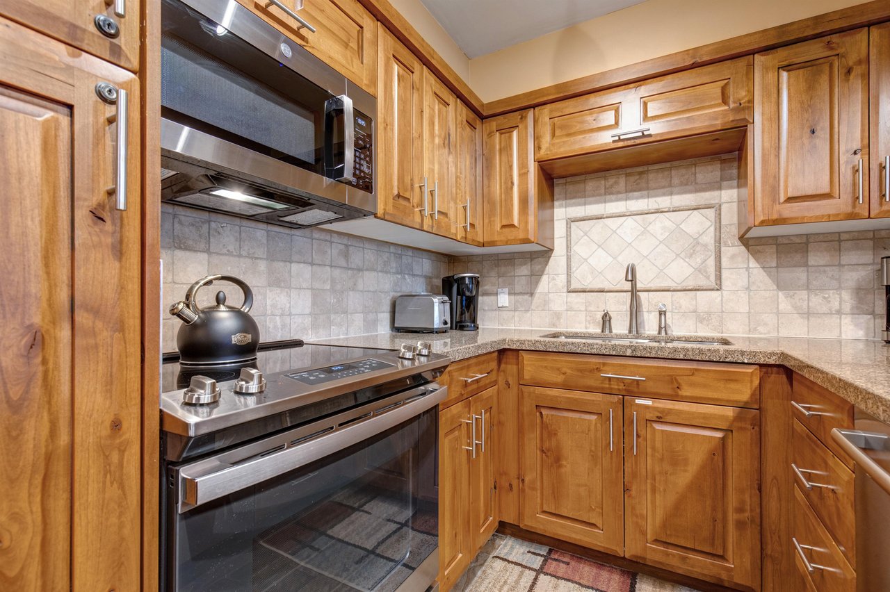 Your fully equipped kitchen features a full oven and glass stove top.