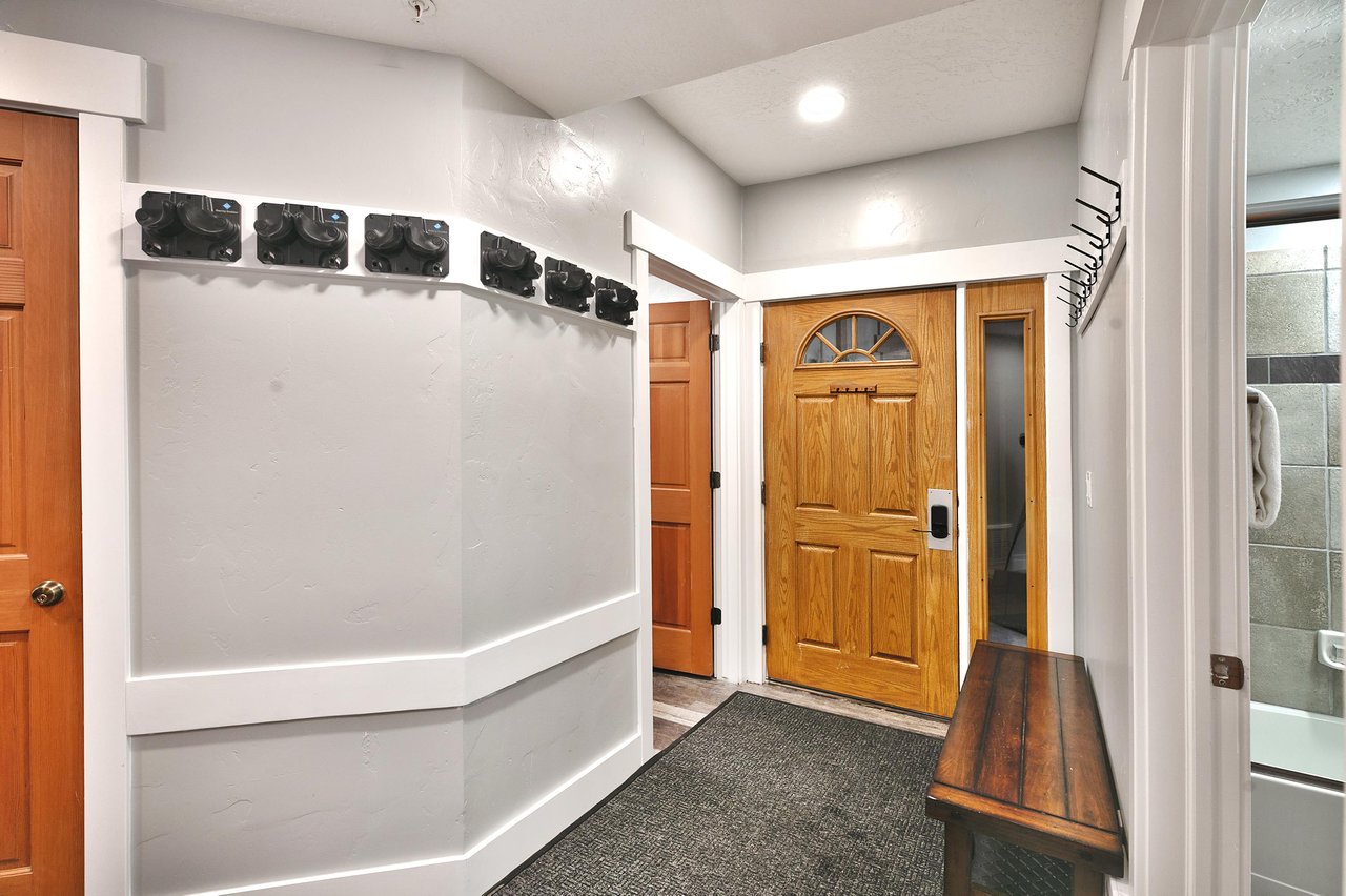Ski racks and coat rack in the entryway