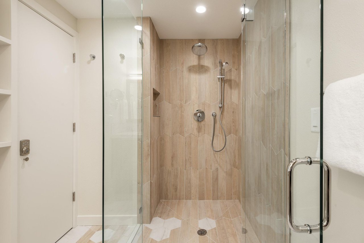 Glass enclosed shower in the main bathroom