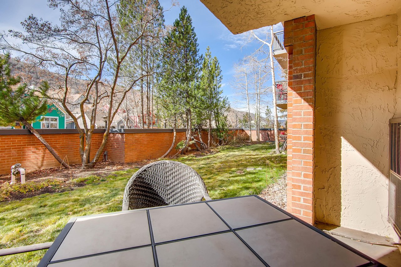 Park Station 113 has a private patio with a sitting area overlooking the trees and mountains beyond.