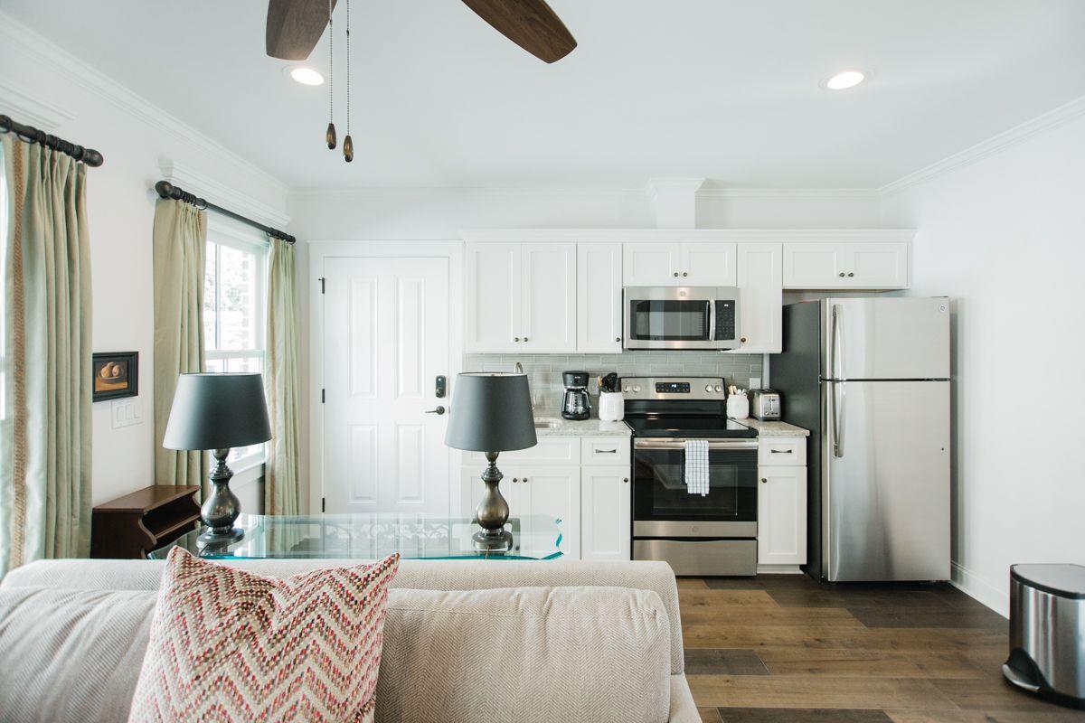 The kitchen offers stainless steel appliances, and fully stocked with cookware.