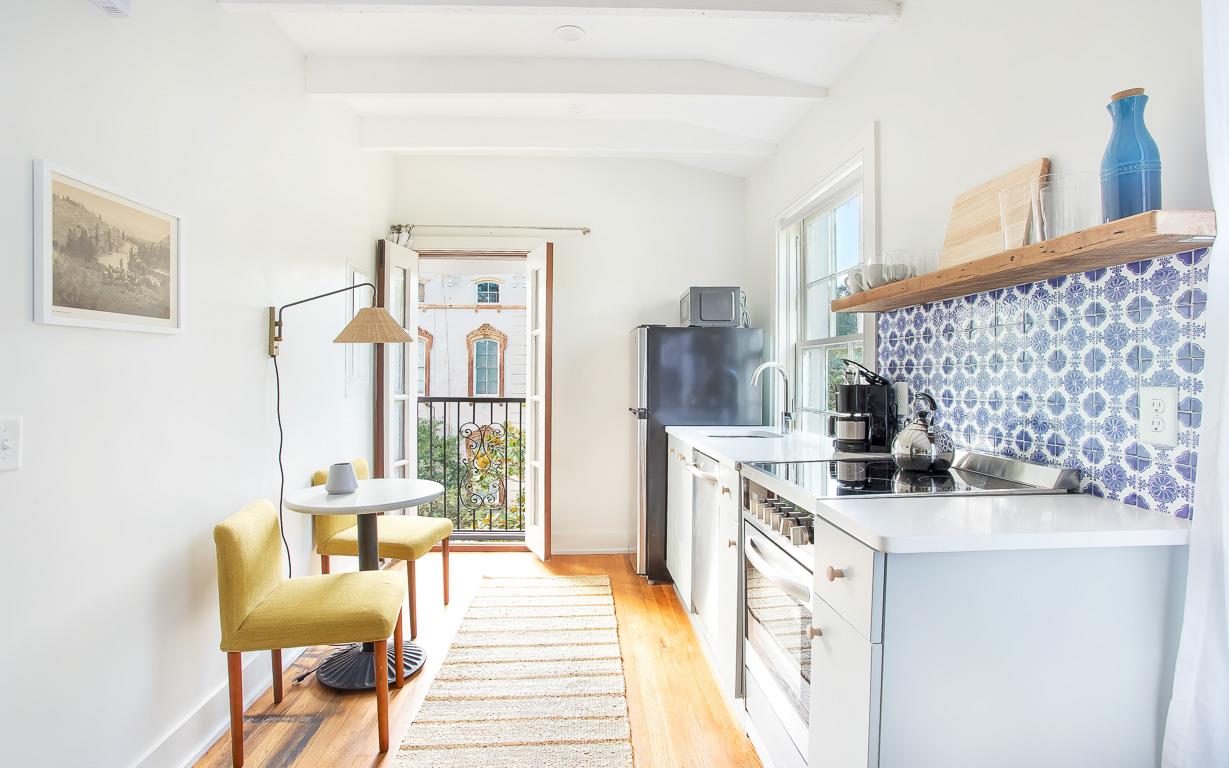 The full kitchen is adjacent to an eating nook for two.