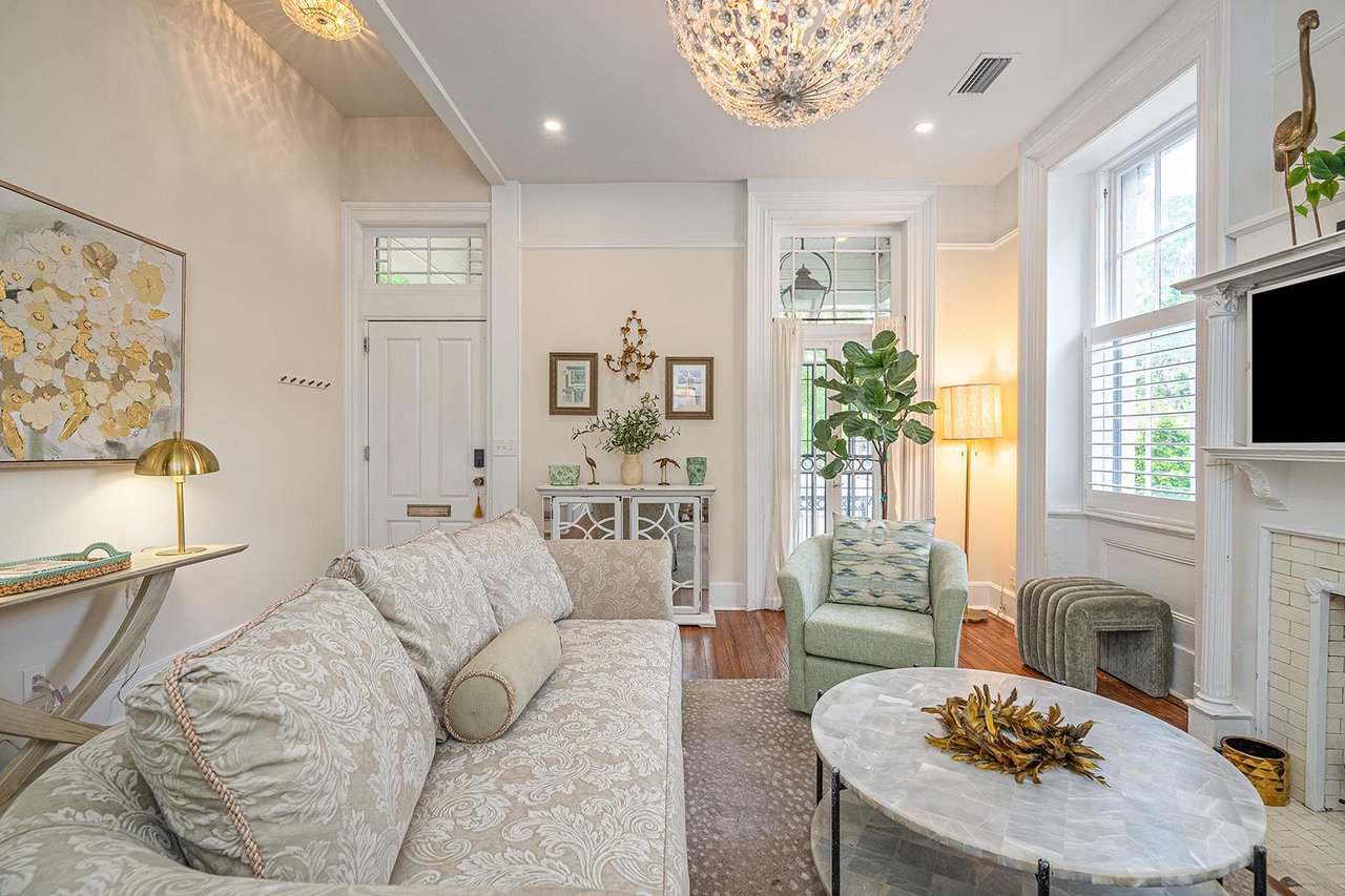 Boasting with natural light, tall ceilings and historic windows, the living room is the perfect place to gather together.