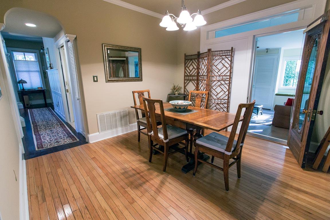 The living room connects the sun room and foyer.