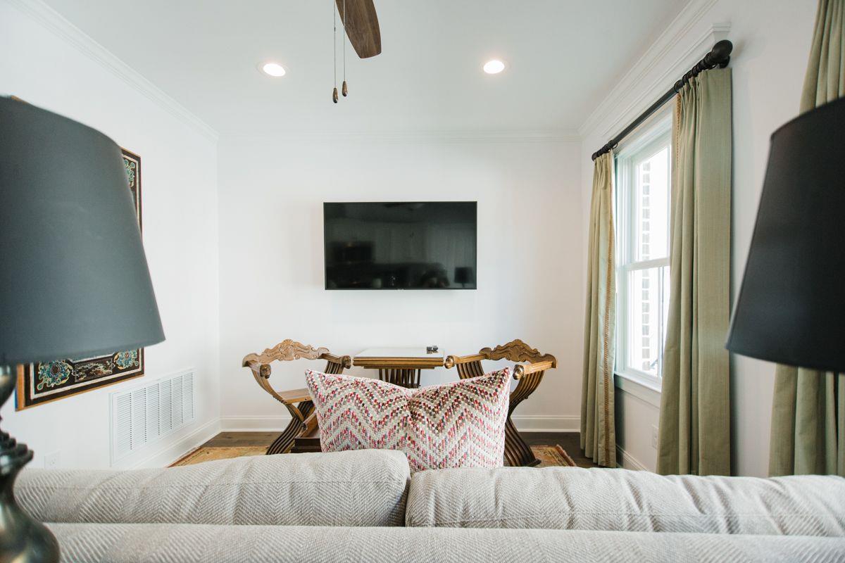 A smart television is mounted center of the room for convenience.