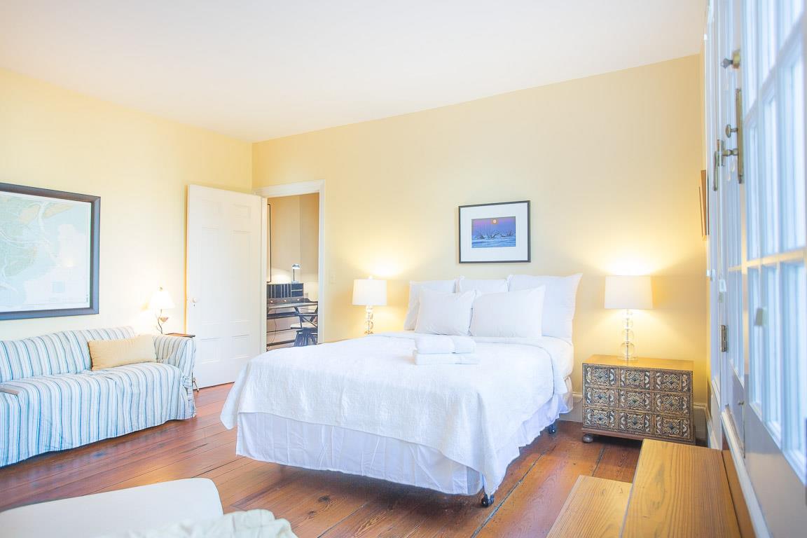 The second bedroom opposite the primary suite.