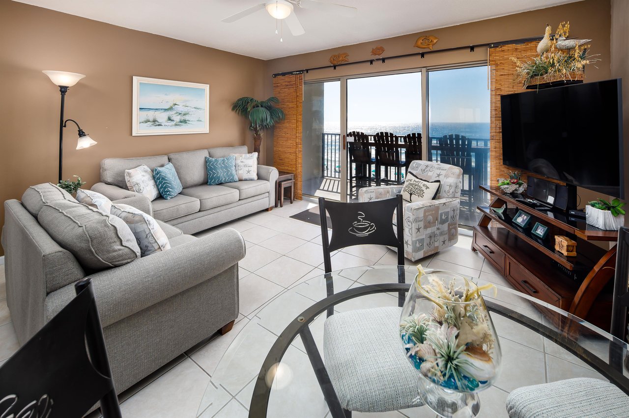 The living room that is creatively decorated.
Featuring this adorable cafestyle table and chair set. The accenting photos on the wall feature the local beaches, creating a welcoming and relaxing envi