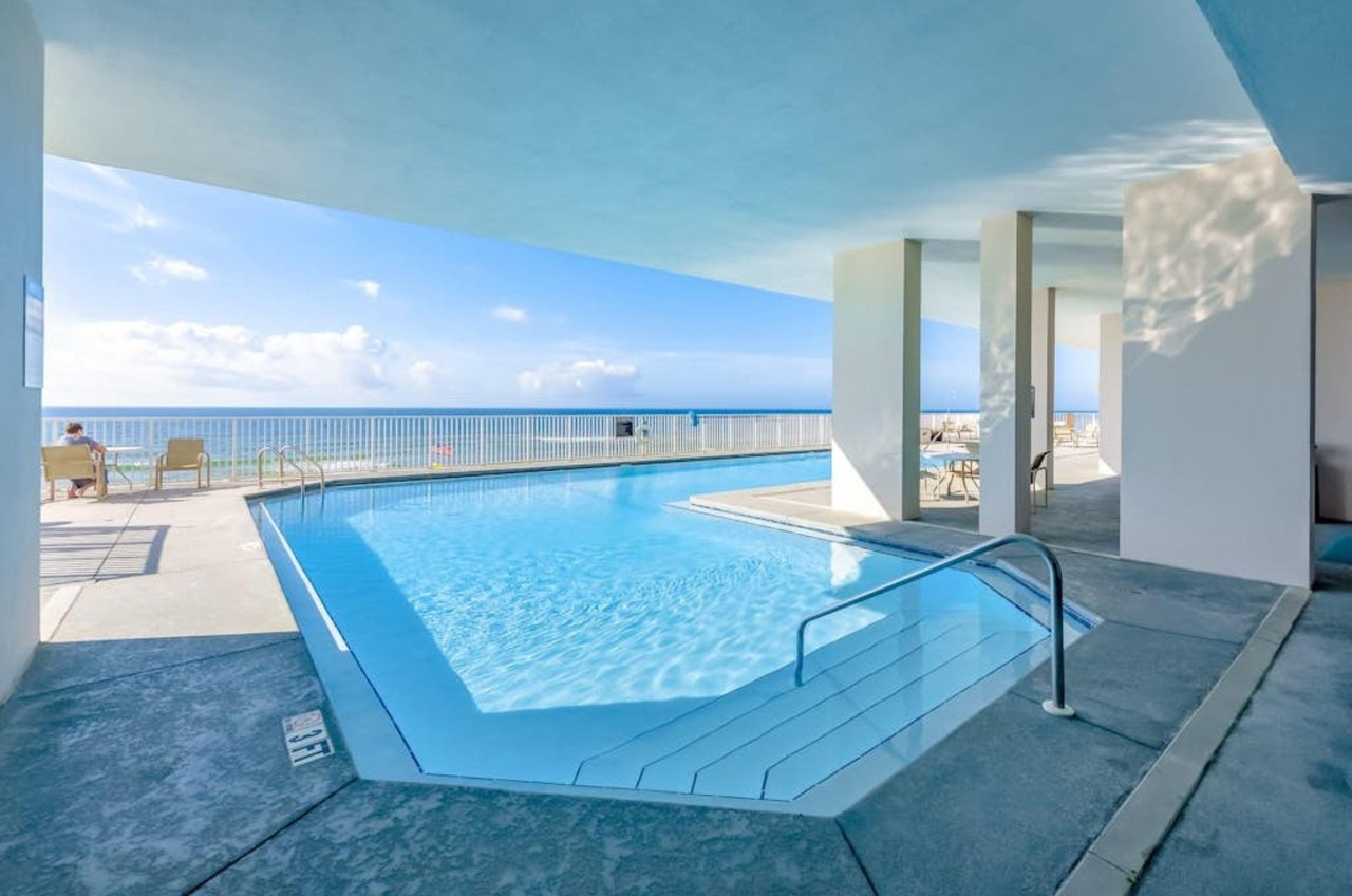The covered end of the the swimming pool at Windemere Condos in Perdido Key Florida