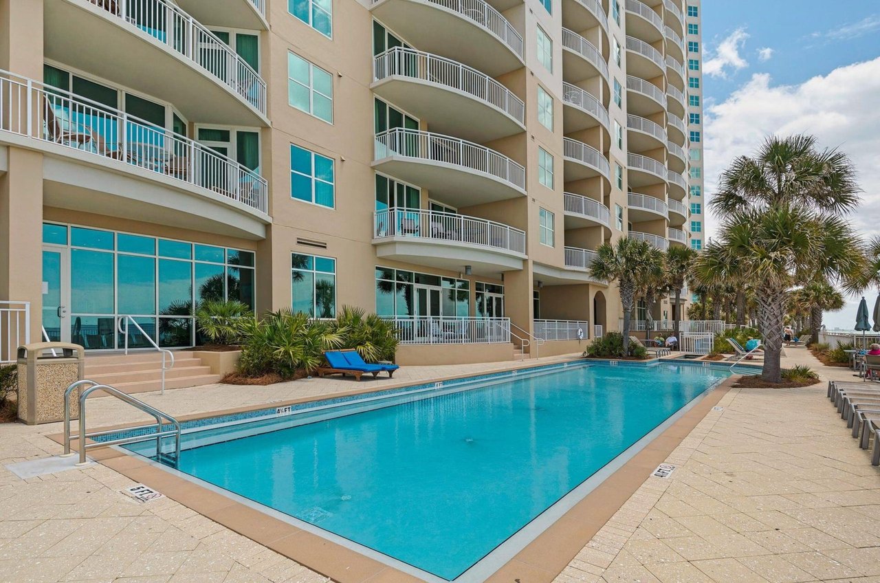 The outdoor swimming pool in front of Aqua Resort in Panama City Beach Florida