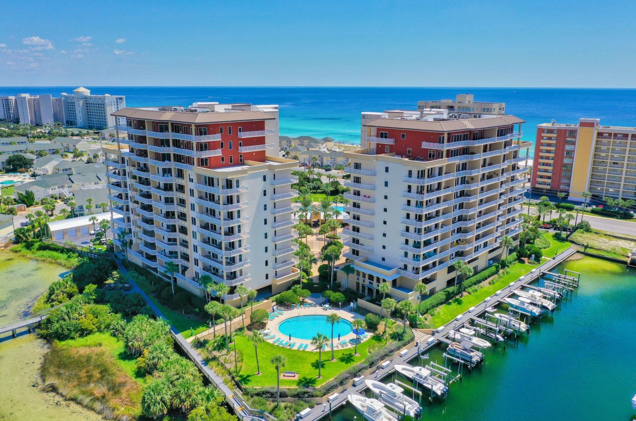 Aerial view of the two towers with a circular owners pool next to the harbor