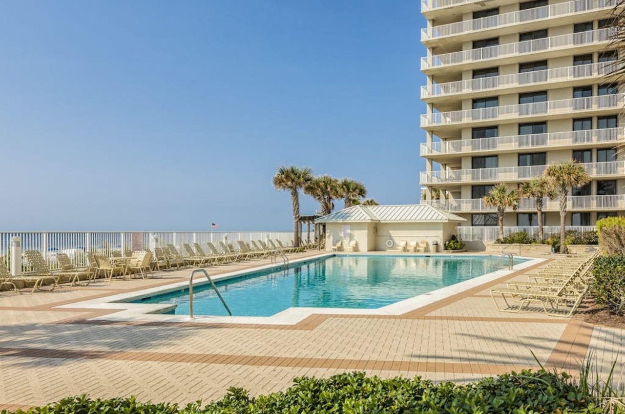 The outdoor swimming pool next to the beach at Pelican Pointe in Orange Beach Alabama