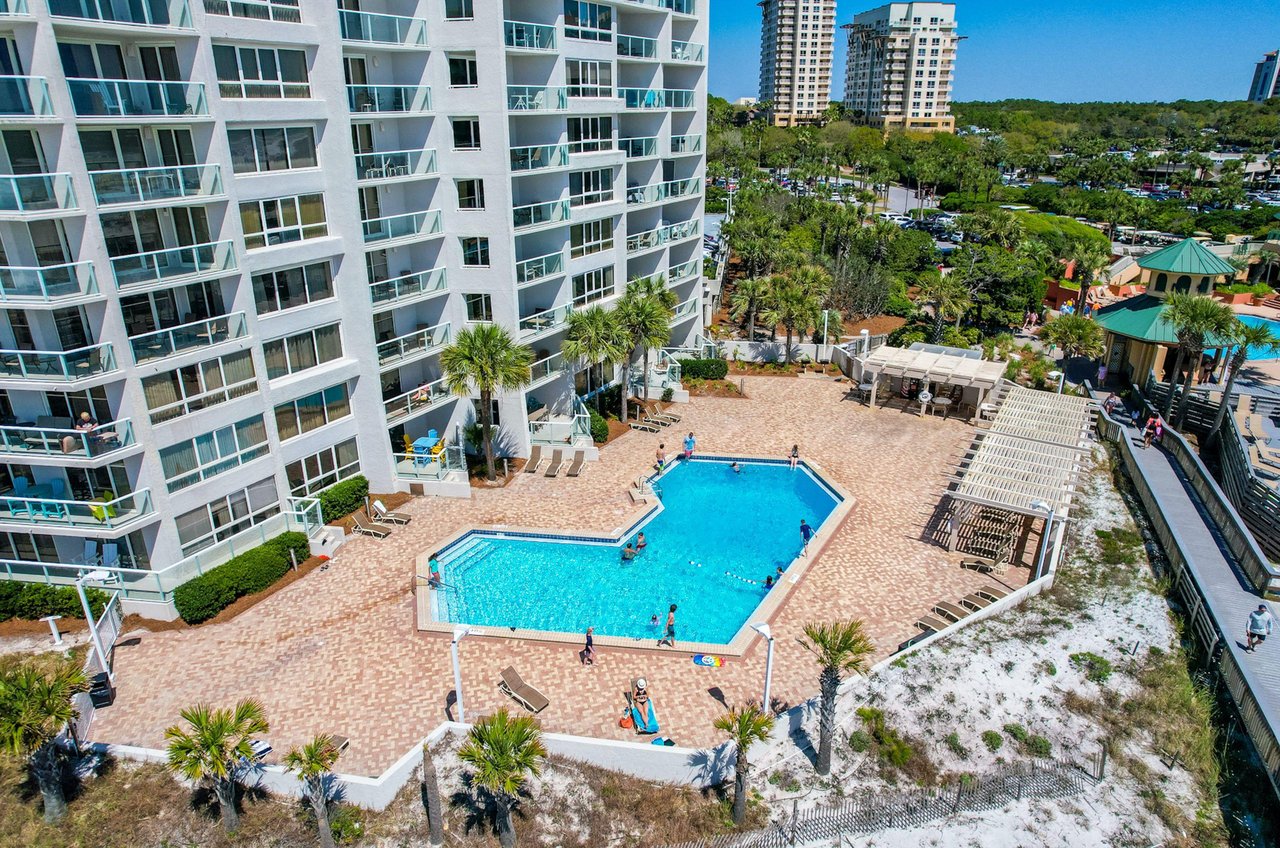 Many of the units have balconies overlooking the swimming pool.