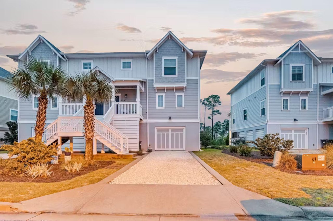 View from the street of a lovely three story rental home in the gated Lost Key community