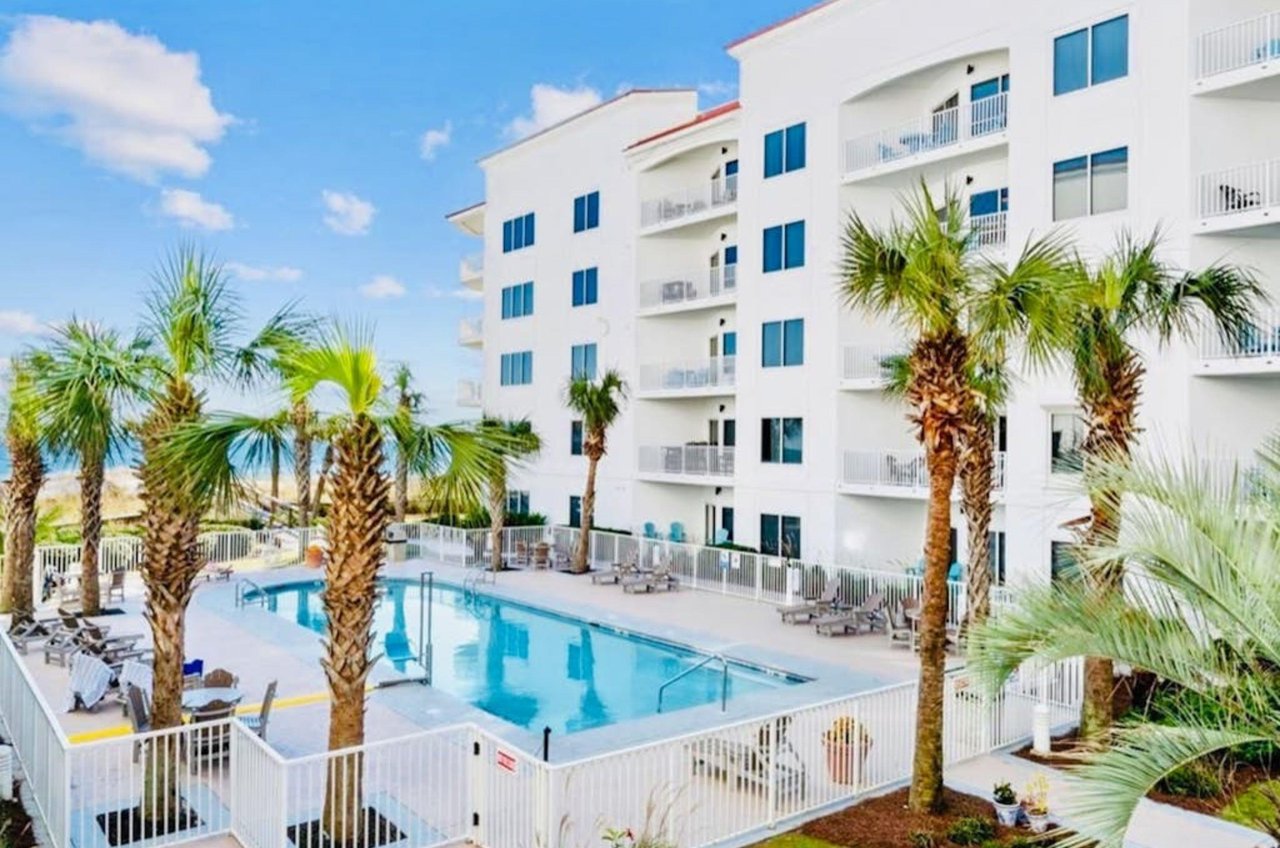 Soak up some sun by the sparkling outdoor swimming pool