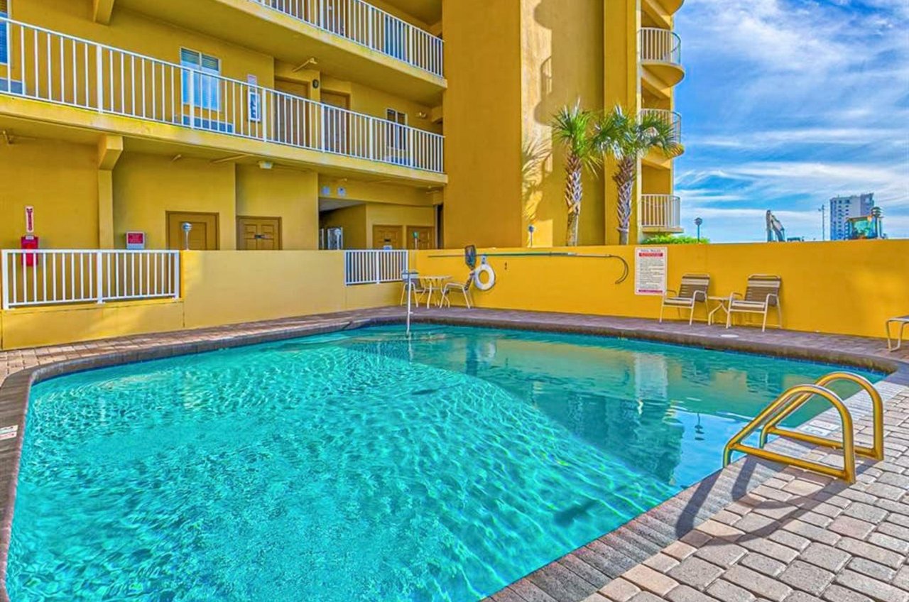 The outdoor swimming pool in front of Emerald Skye in Orange Beach Alabama