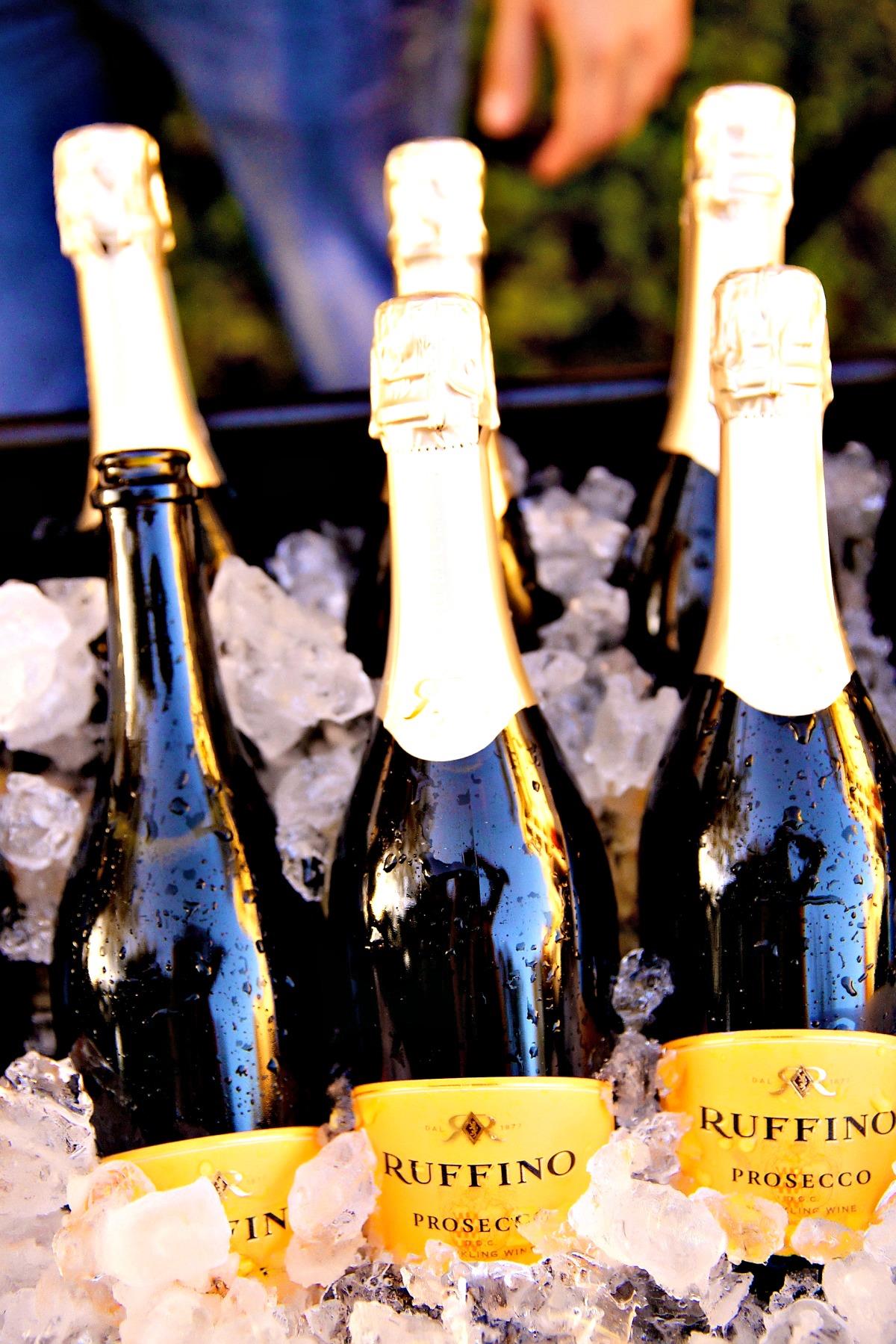 58770 Sparklingwineandholidaylightsbottlesofproseccoonice