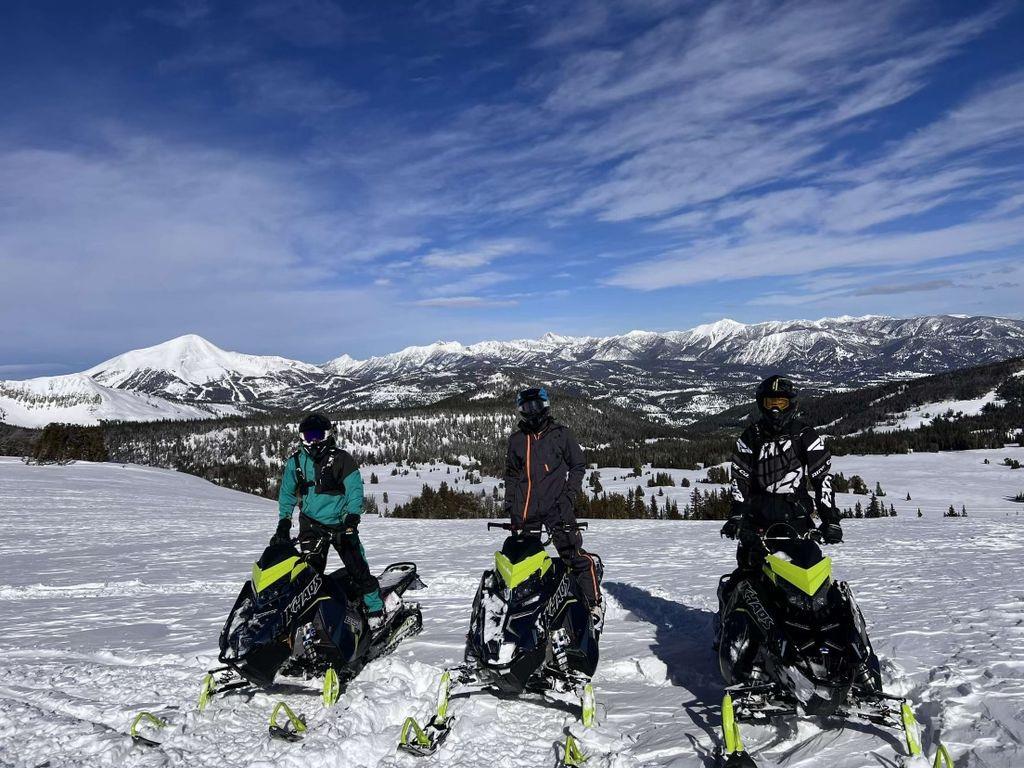 21 A Group Of People On Snow Skis Posing For The Camera