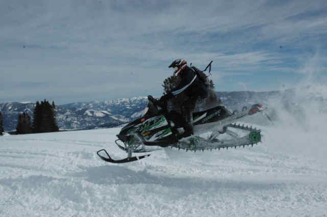 24 A Person Riding A Snowmobile