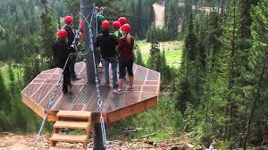44 A Group Of People On A Wooden Platform In The Woods