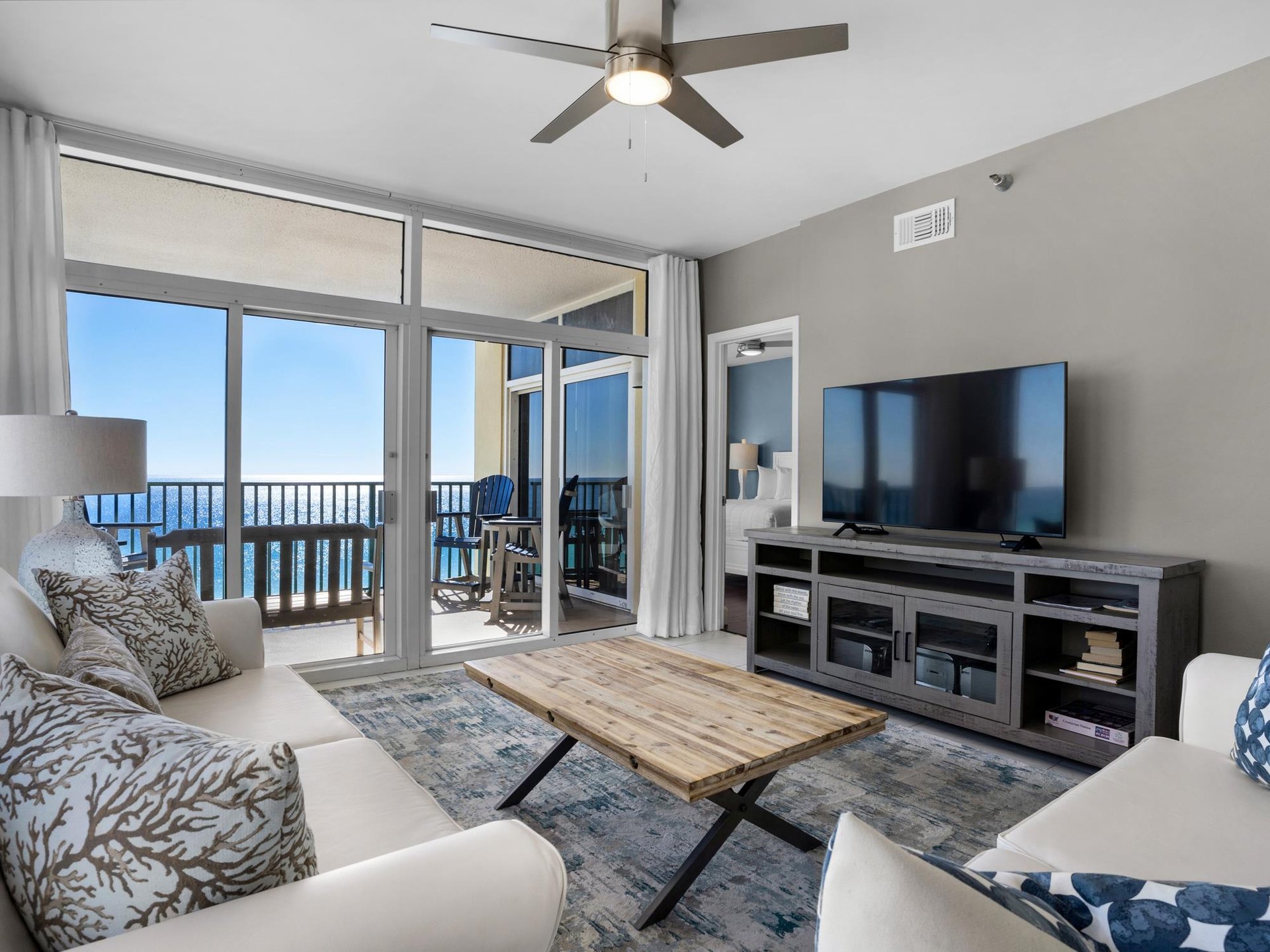 Living Area with Flat Screen and Access to Private Balcony