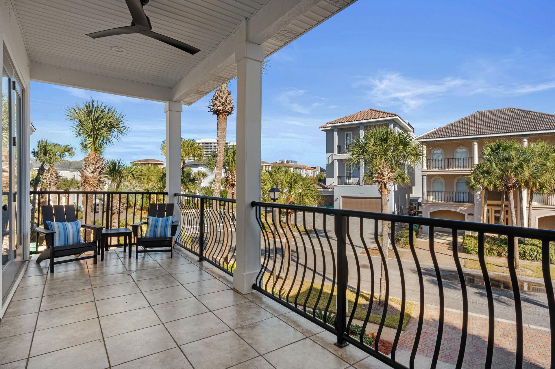 Soak up the coastal atmosphere from your private covered balcony, complete with comfortable seating and tropical palm views.