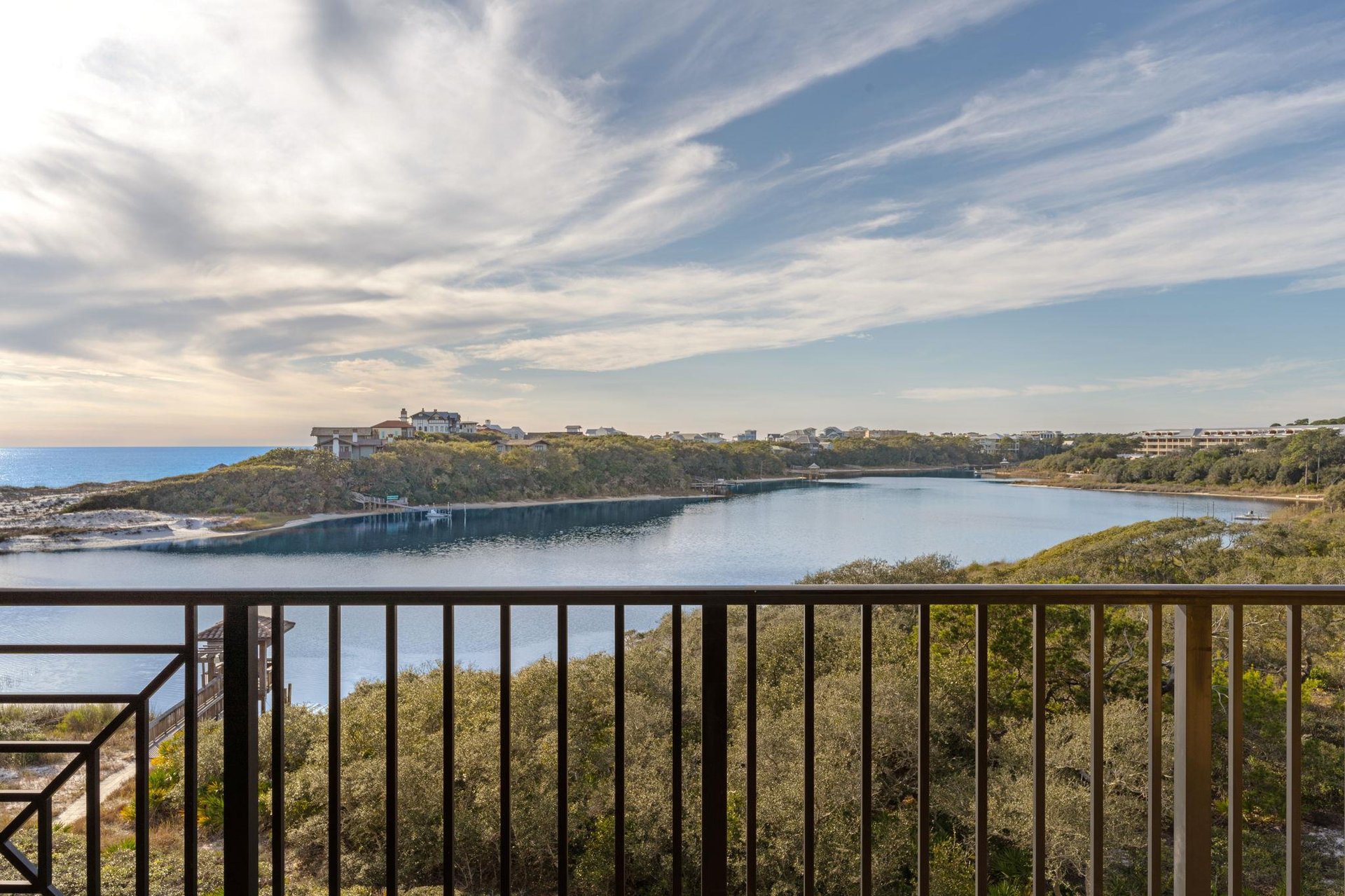 Sweeping lake views framed by natural coastline create a serene backdrop for this elevated gulf and lakeside location.