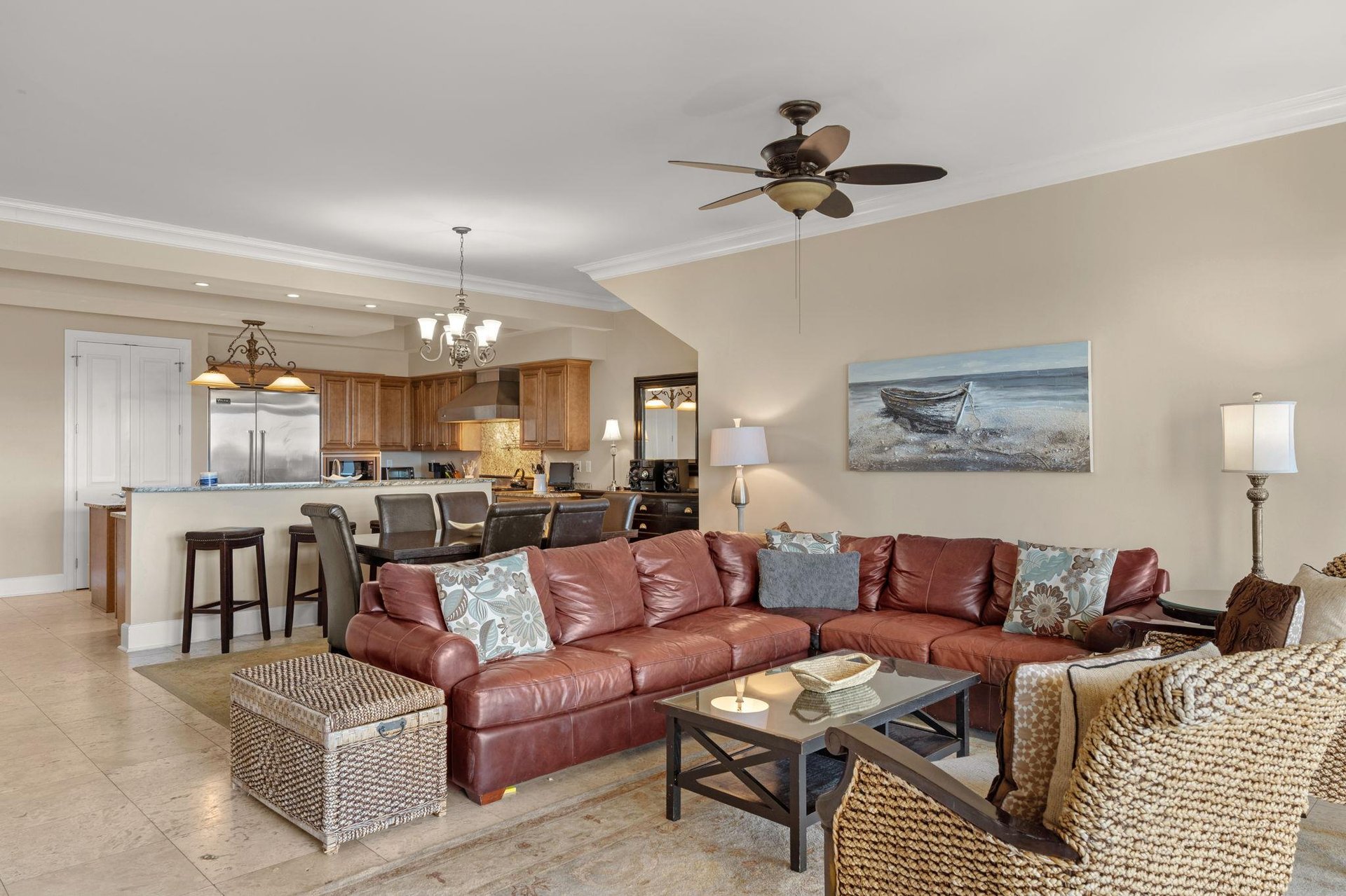 Sink into plush leather seating while coastal breezes flow through your openconcept living space, where kitchen and comfort merge seamlessly.