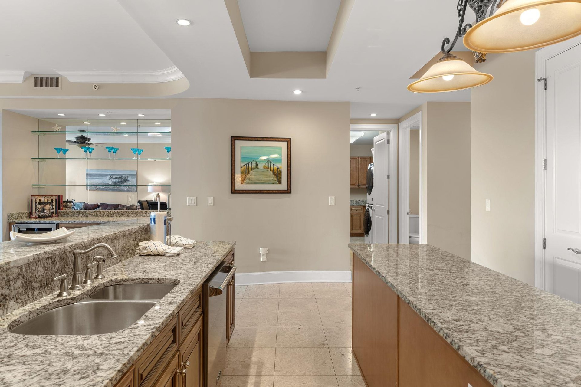 Your spacious kitchen invites culinary adventures with granite countertops, modern appliances, and elegant pendant lighting creating the perfect cooking sanctuary.