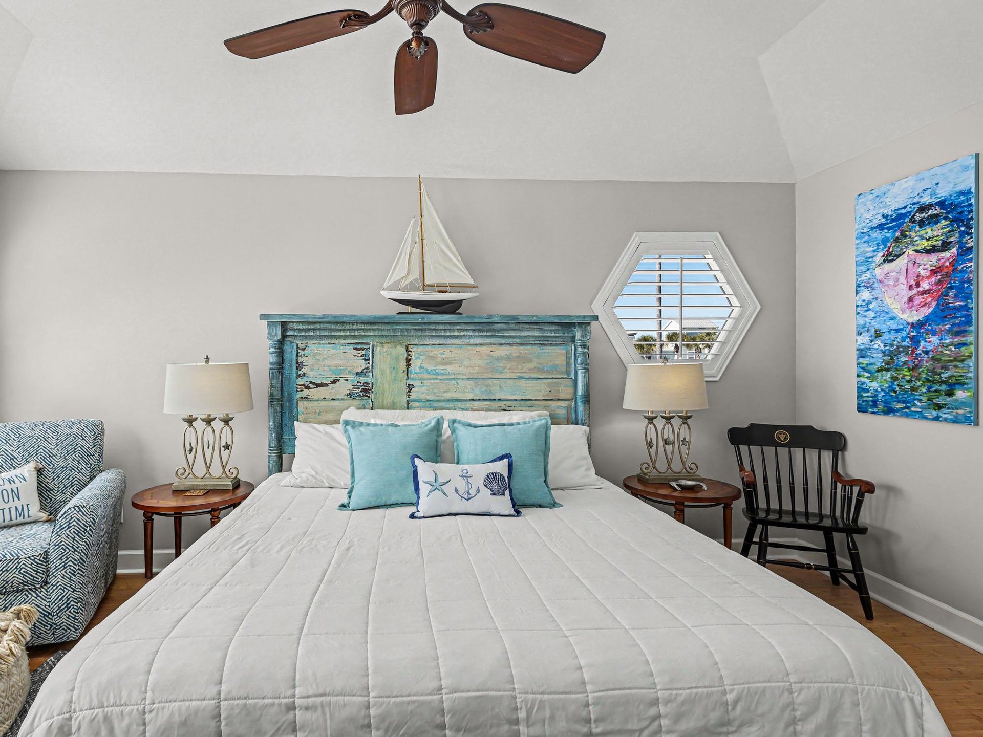 Drift off in this coastalthemed bedroom where nautical charm meets comfort. Your peaceful retreat features oceaninspired decor and gentle ceiling fan breezes.